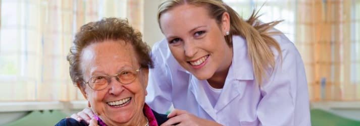Senior and nurse in assisted living