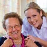 Senior resident and nurse in assisted living