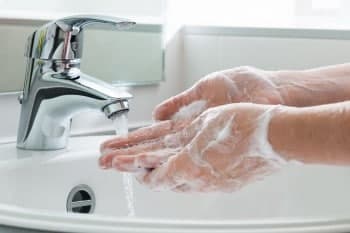 Washing hands under running water