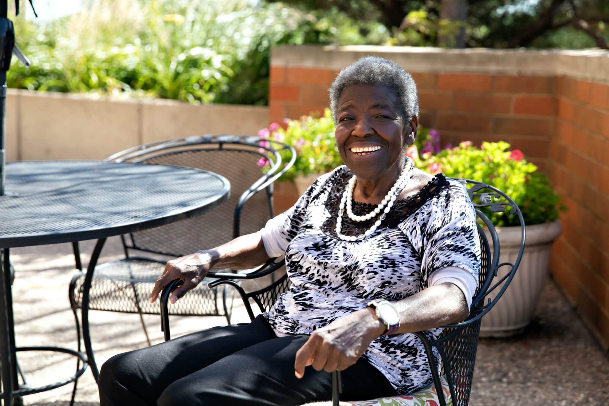 Senior resident sitting outside